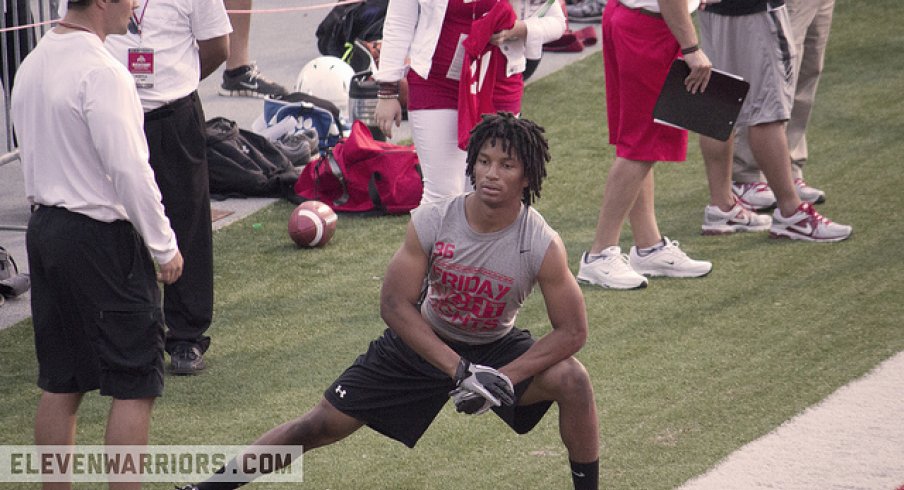 Erick Smith stretches at a Friday Night Lights camp in 2013.