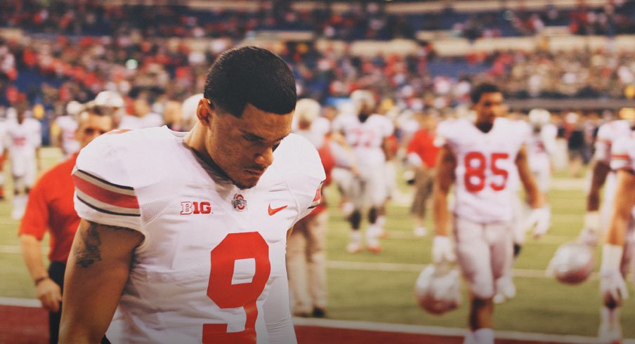 Devin Smith walks off the field dejected following Ohio State's loss to Michigan State in the Big Ten Championship Game.