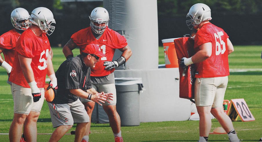 Ed Warinner coaches up his linemen at a recent Ohio State practice.