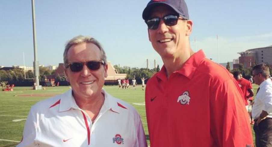 ESPN's Brad Nessler and Todd Blackledge were forced to change out of blue shirts today at practice.