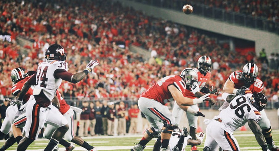 In this rare photo, J.T. Barrett has time to throw.