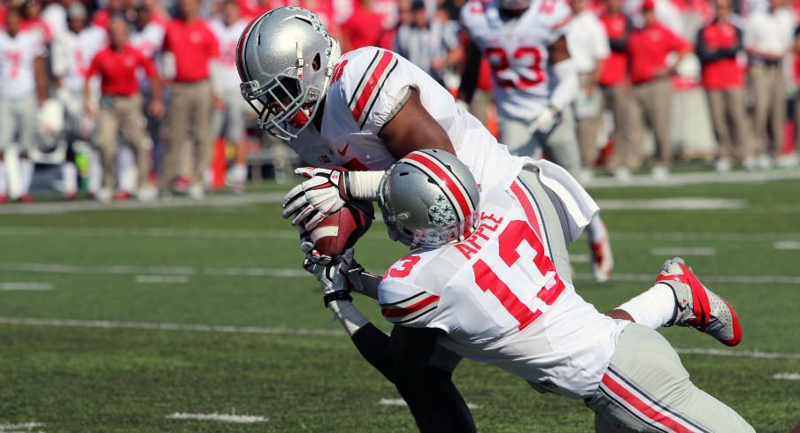 Raekwon McMillan steals a pass from both Maryland and teammate Eli Apple.
