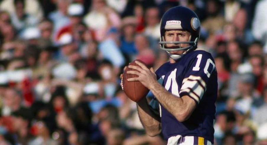 Fran Tarkenton throwing darts