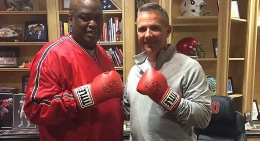 These two know how to throw them thangs, Urban Meyer and Buster Douglas