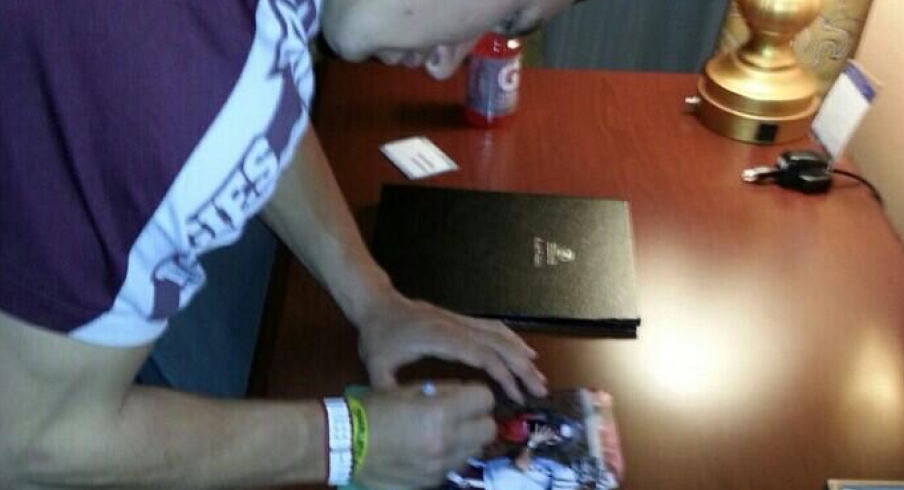 Johnny Football allegedly signing autographs for money in a hotel room