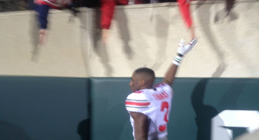Michael Thomas exchanges high fives after Ohio State defeated Michigan State.