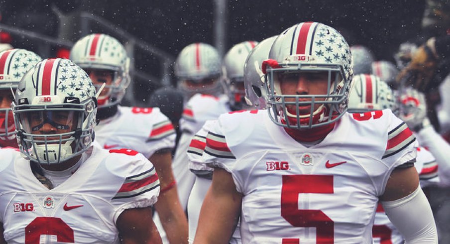 Evan Spencer and Jeff Heuerman take the field against the Gophers