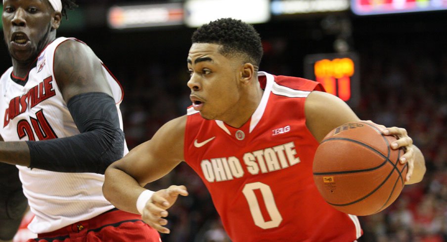 D'Angelo Russell drives by Montrezl Harrell