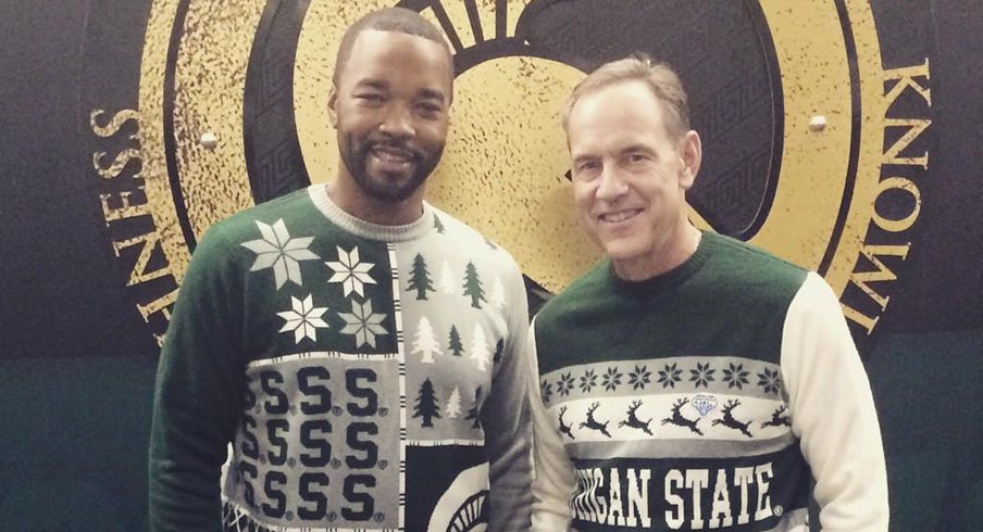 Here's a photo of Michigan State coach Mark Dantonio wearing an ugly holiday Christmas sweater.