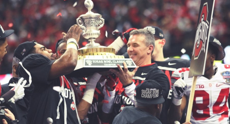 Sugar Bowl offensive MVP Ezekiel Elliott and head coach Urban Meyer hoist the Sugar Bowl hardware.