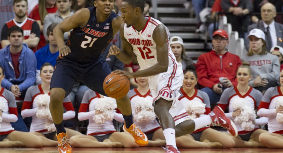 Sam Thompson dribbles past defender.