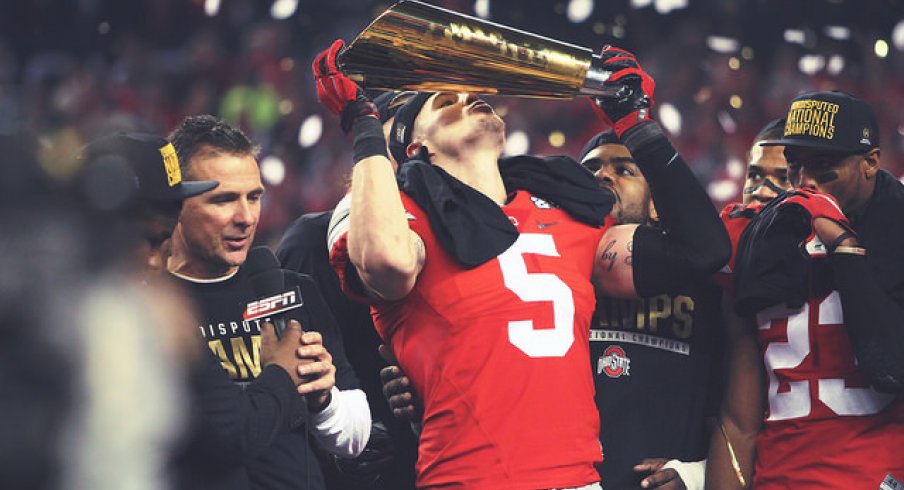 Ohio State senior captain Jeff Heuerman kisses the National Championship trophy.