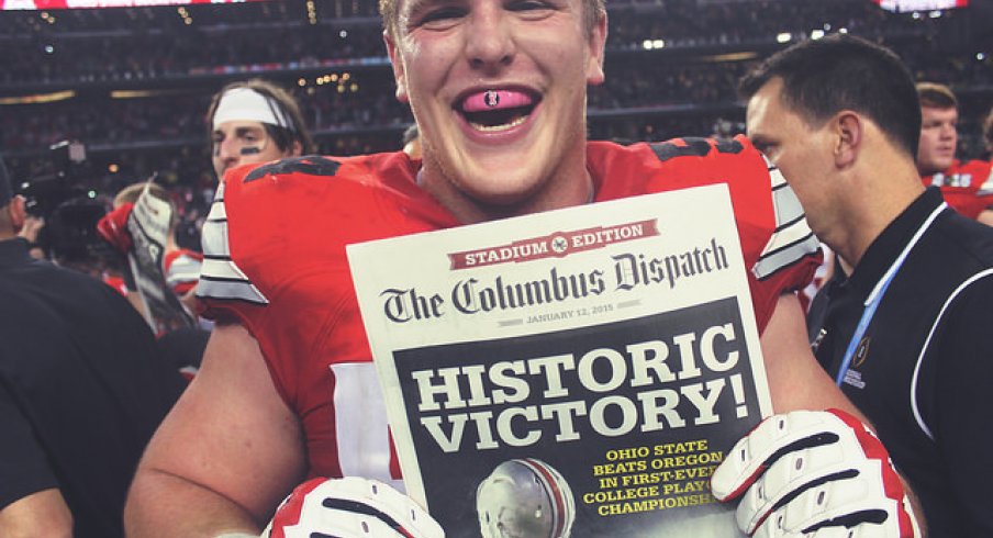Billy Price holding the Columbus Dispatch after the national title game. 