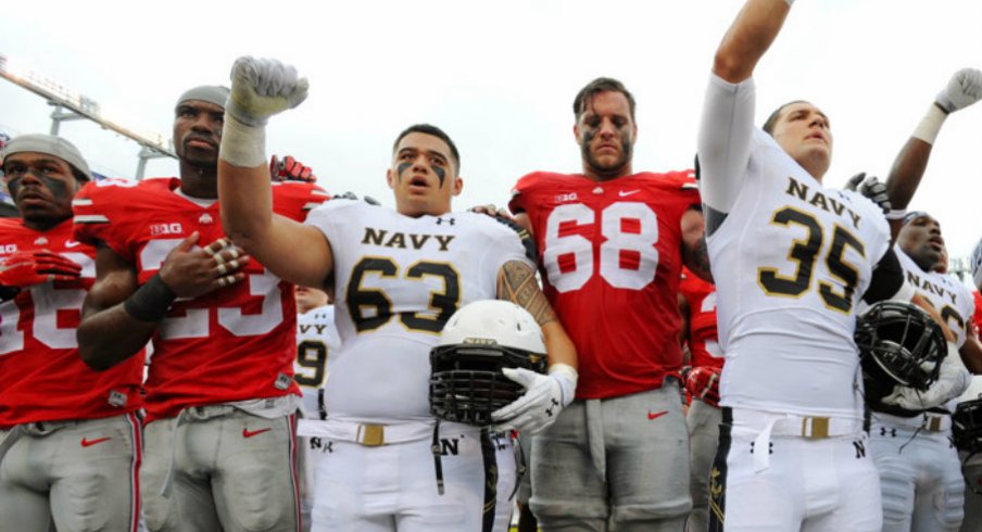 Ohio State and Navy players sing after the game. 