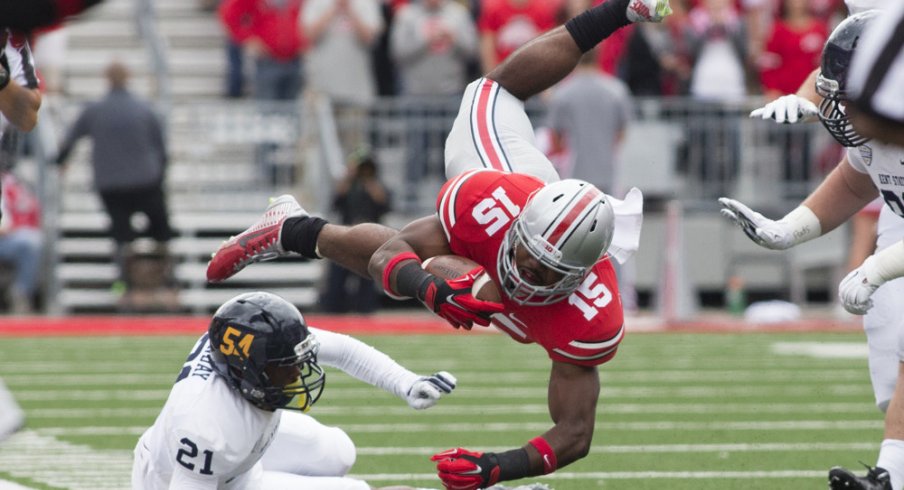 Ezekiel Elliott leaps over a Kent State defender. 