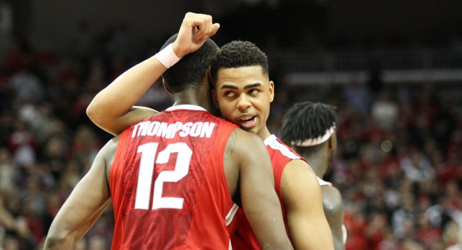 D'Angelo Russell hugs Sam Thompson