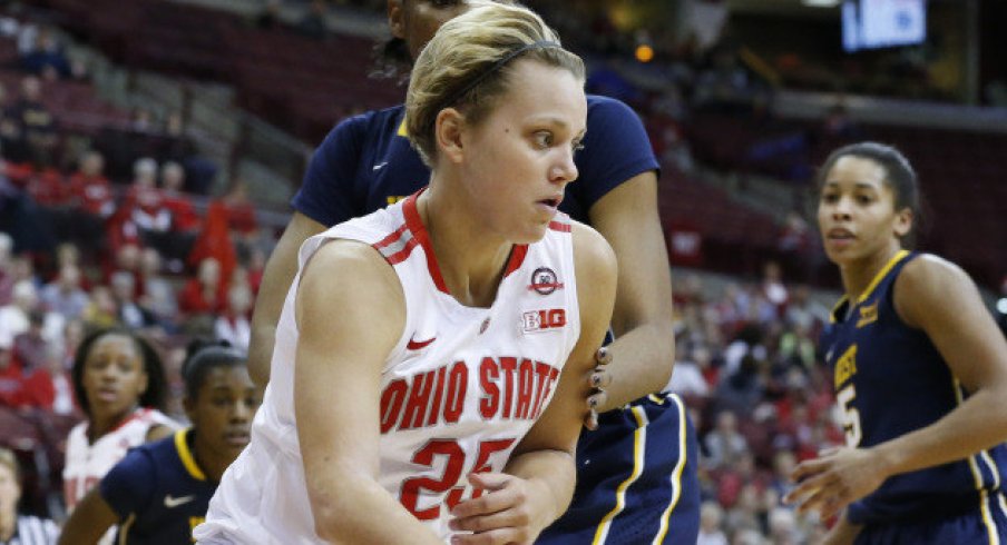 Amy Scullion driving to the hoop.