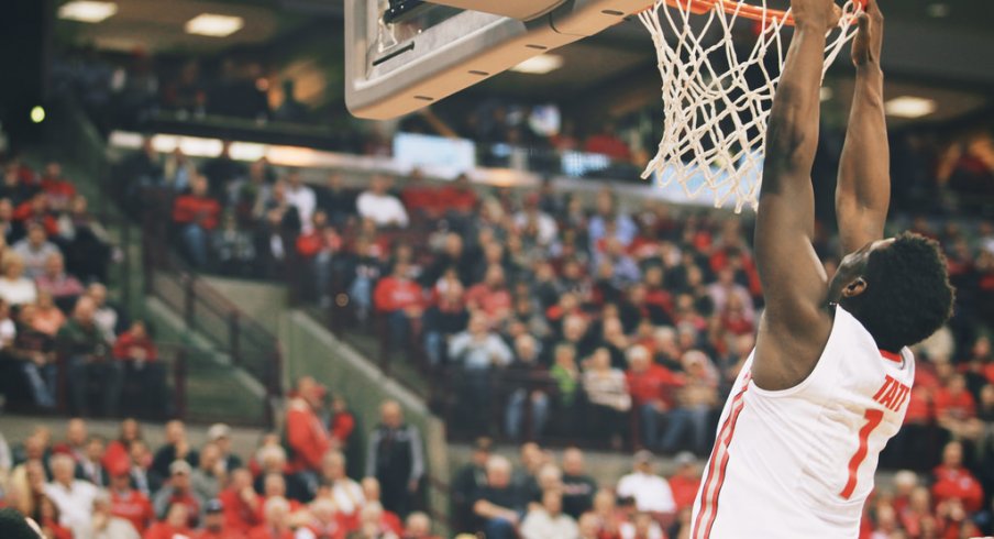 Jae'Sean Tate hangs on the rim.