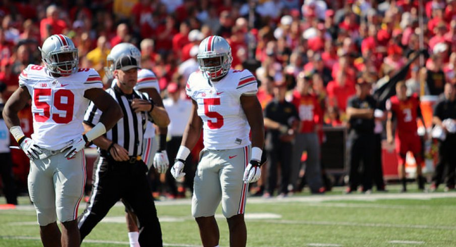 Tyquan Lewis (59) and Raekwon McMillan (5)