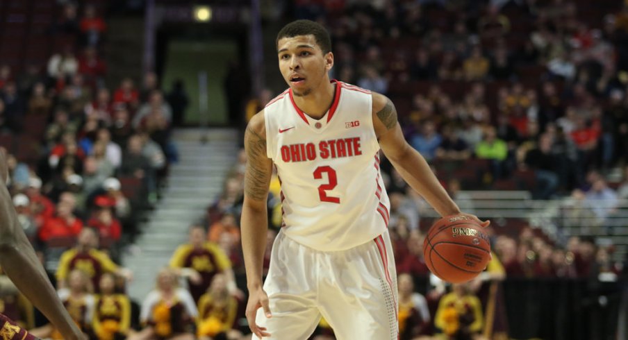 Marc Loving dribbles against Minnesota.