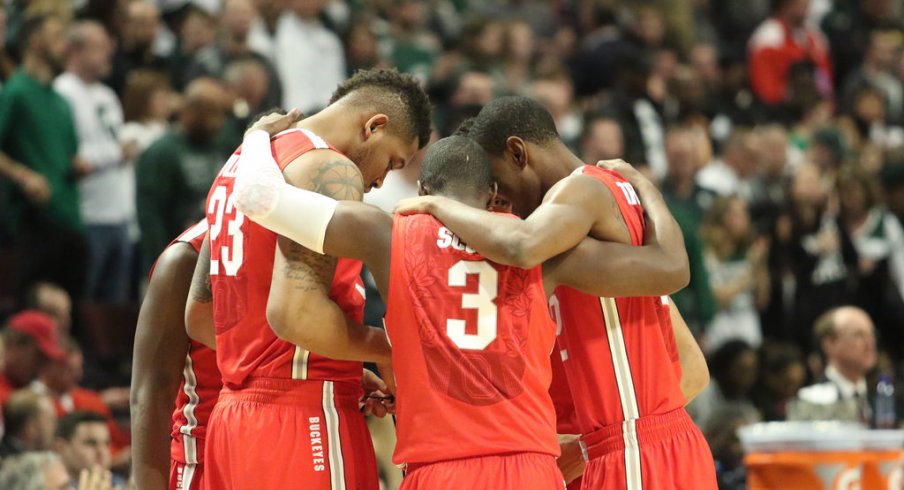 Ohio State huddles vs. Michigan State.