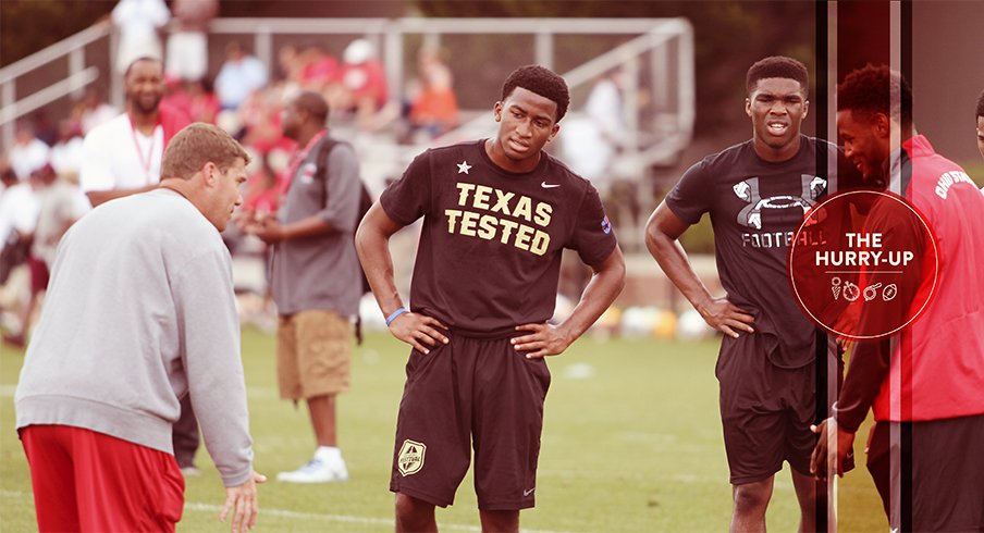 Jaylon Jones and Jeffrey Okudah receive instruction from Chris Ash and Vonn Benn