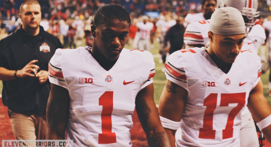 Dontre Wilson and Jalin Marshall walk off the field.