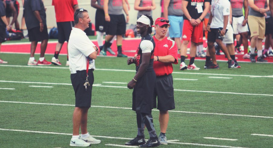 Urban Meyer, Mickey Marotti an Demario McCall at Friday Night Lights.