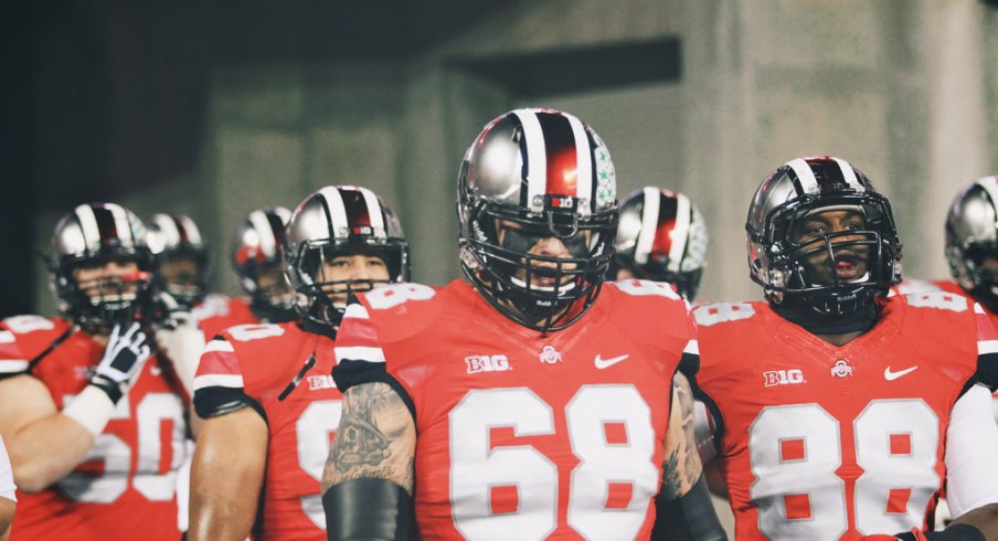 Ohio State led by Taylor Decker into Ohio Stadium.