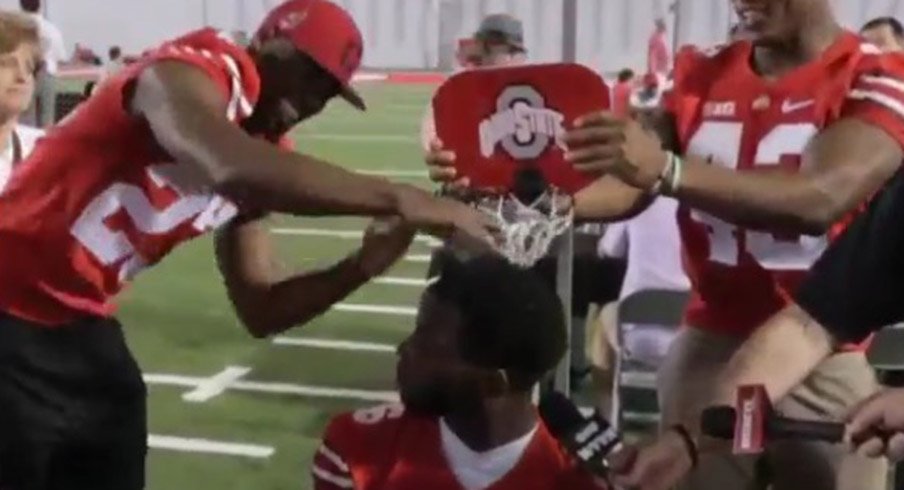 Tyvis Powell and Darron Lee slam on an unsuspecting J.T. Barrett.