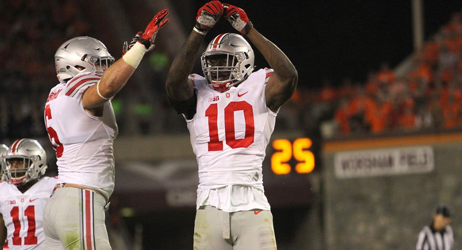 Sam Hubbard and Jalyn Holmes celebrate at Virginia Tech