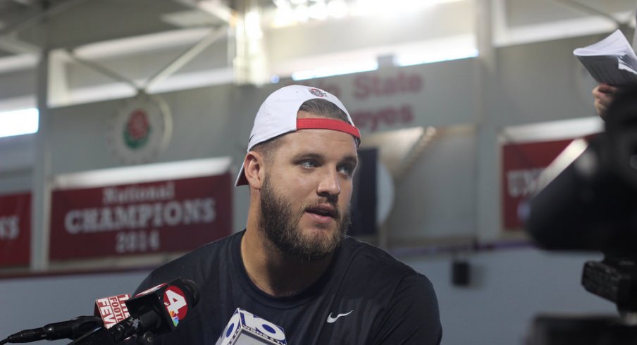 Taylor Decker meets with the media.