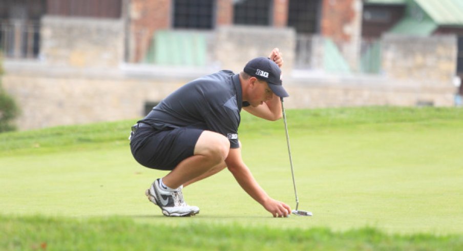 Sophomore Josh Wick Lining Up A Putt 