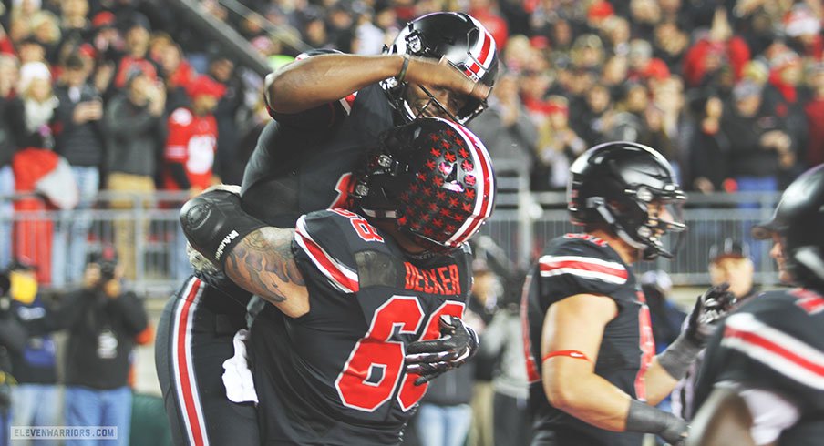 J.T. Barrett and Taylor Decker celebrate in the end zone.