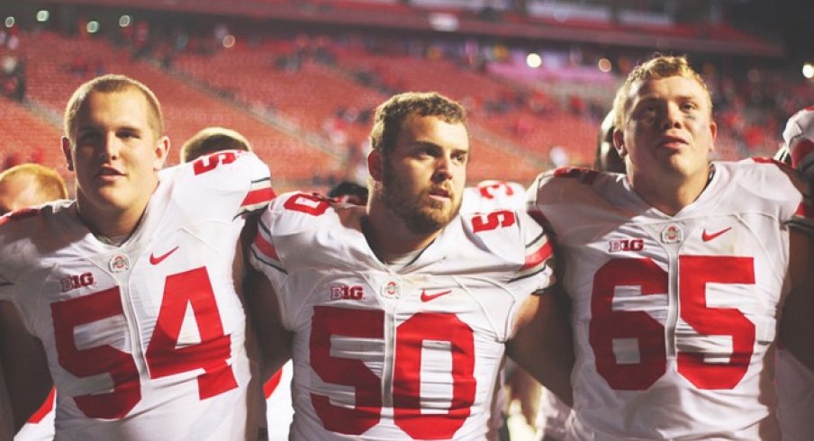 Billy Price, Jacoby Boren, and Pat Elflein sing Carmen Ohio after beating Rutgers.