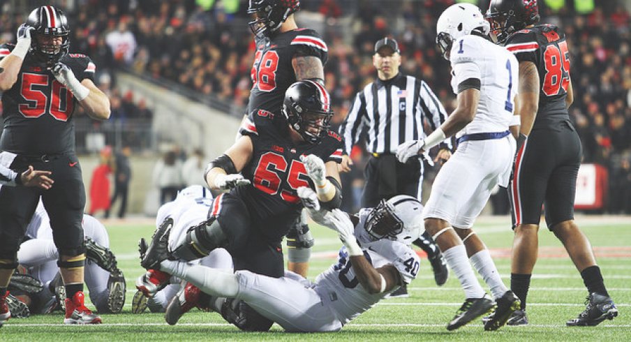 Pat Elflein puts a Nittany Lion to the turf.