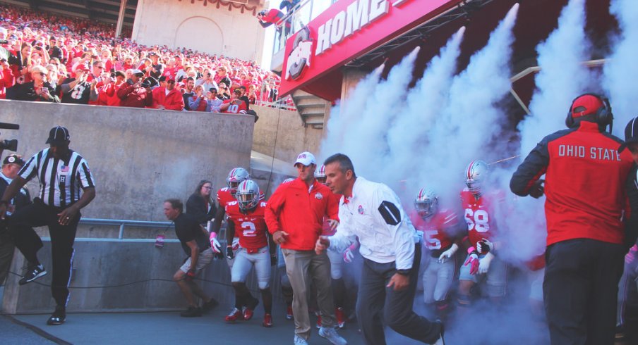 Urban Meyer, Ohio State take the field.