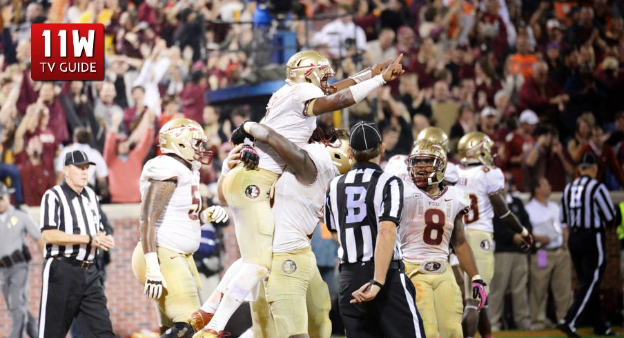 OCT. 19, 2013: Florida State's quarterback Jameis Winston celebrates a touchdown during the Florida State Seminoles and Clemson Tigers game at Memorial Stadium in Clemson, South Carolina. Florida State beat Clemson 51-14. 