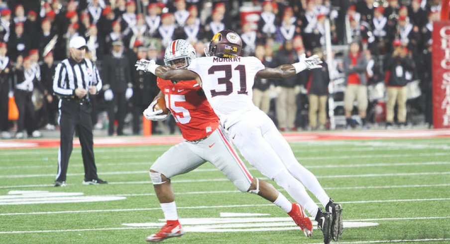 Ezekiel Elliott warding off an evil Minnesotan spirit.