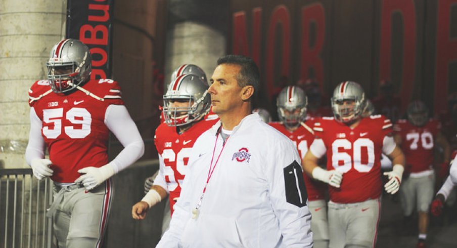Urban Meyer salutes the vets.