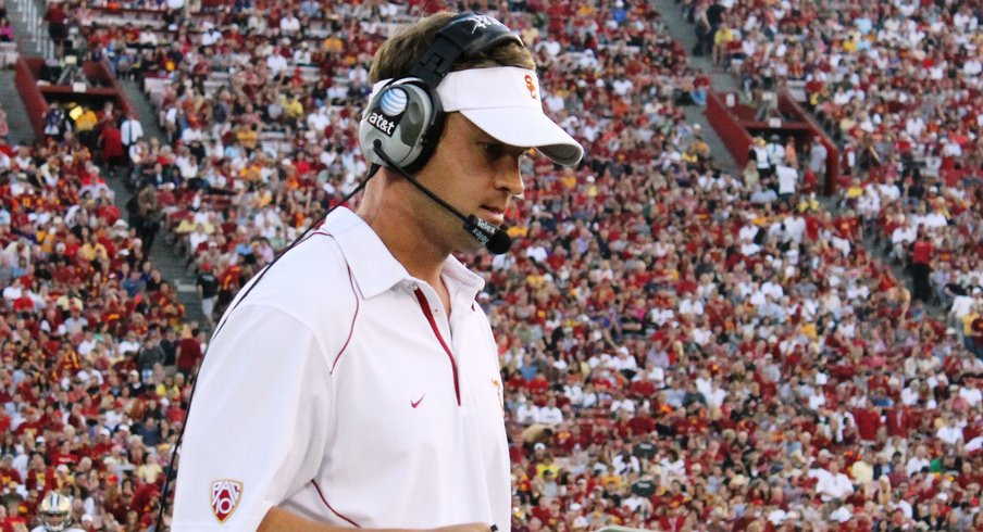 LOS ANGELES, CA - OCTOBER 02: USC Coach Lane Kiffin consults his play chart in the second quarter against Washington at the Los Angeles Memorial Coliseum on October 2, 2010 in Los Angeles, California. Washington won 32-31. (Photo by Shotgun Spratling/Neon Tommy)