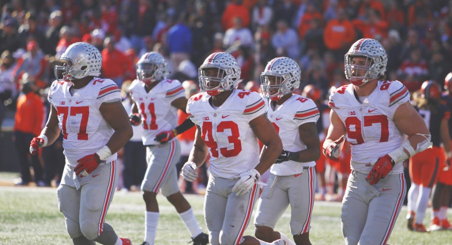 Ohio State's defense jogs off the field against Illinois. 