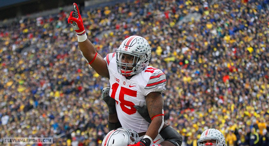 Ezekiel Elliott celebrates a touchdown run against Michigan. 