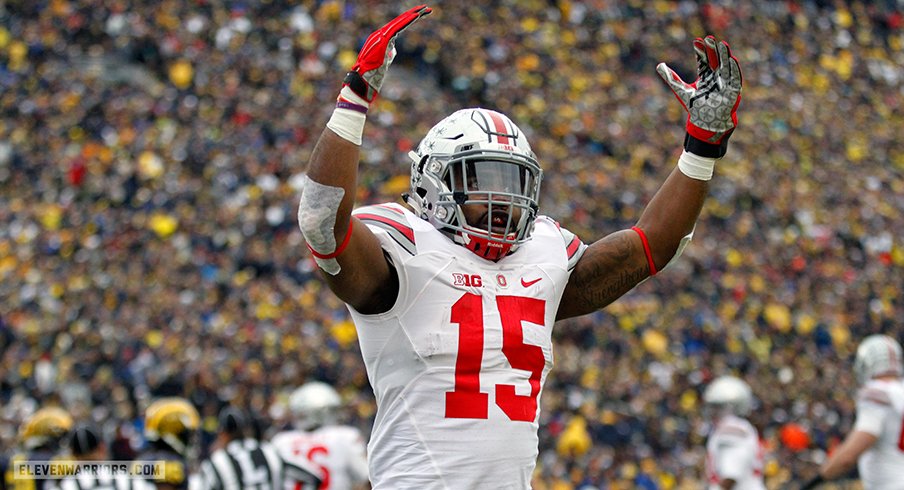 Ezekiel Elliott celebrates in front of Michigan crowd