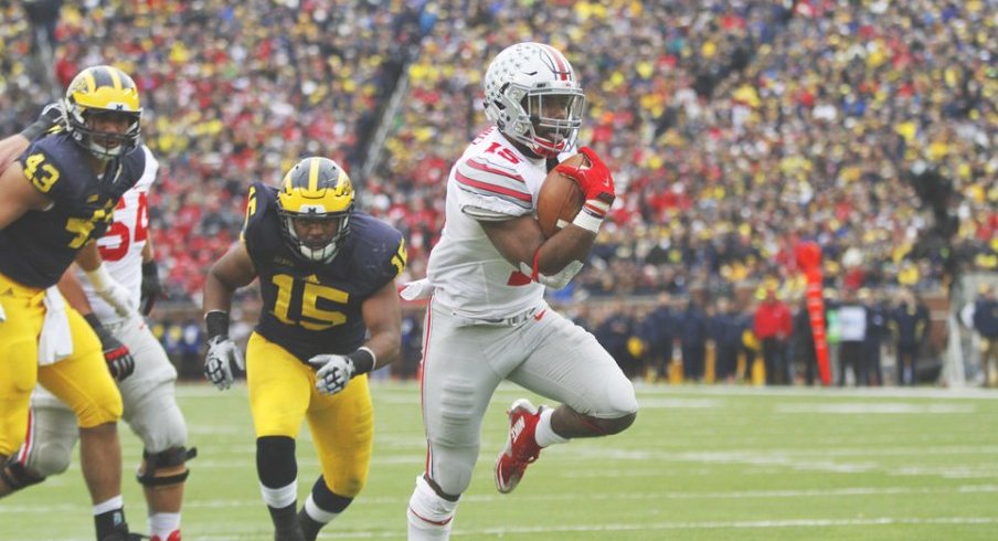 Ezekiel Elliott ran around and through Michigan's defense with 214 yards and two scores. 