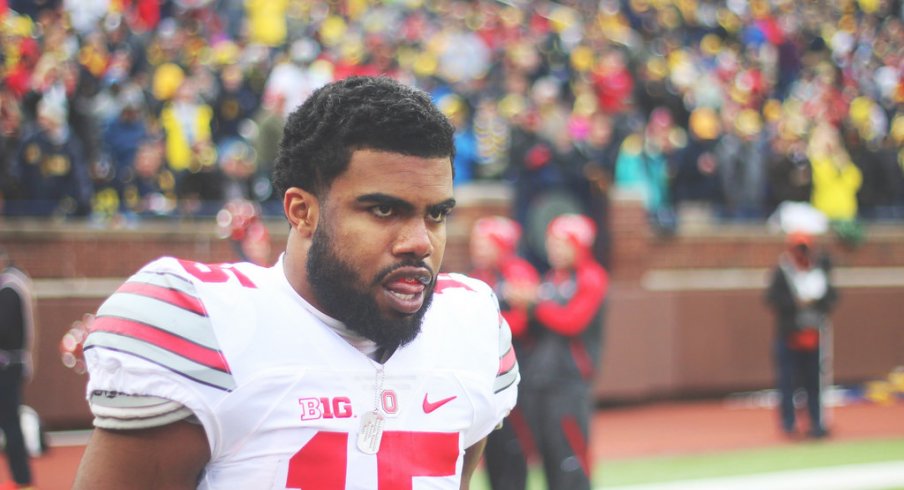 Ezekiel Elliott strolls the sidelines vs. Michigan.