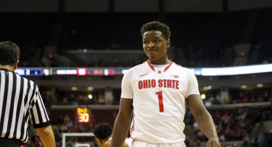 Jae'Sean Tate on the floor against Virginia. 