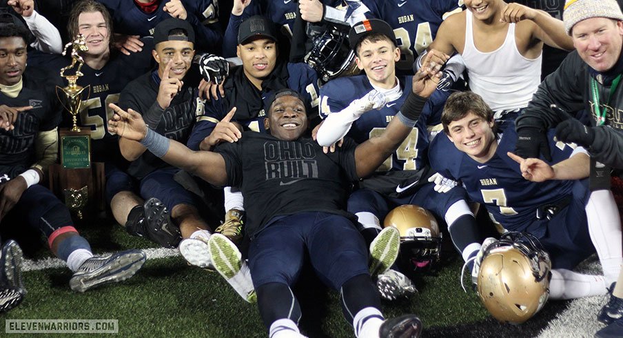 Todd Sibley and Akron Hoban celebrate their first state title.