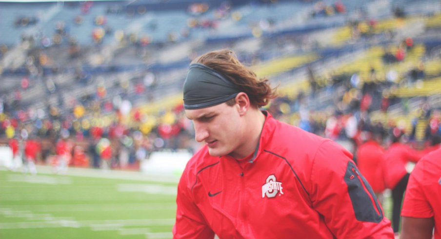 Joey Bosa warms up for the Michigan game. 