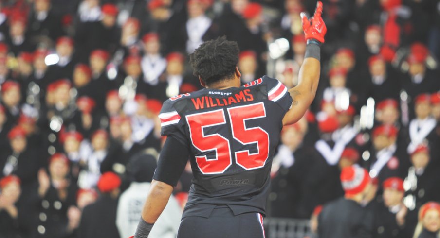 Cam Williams runs out on the field vs. Penn State.